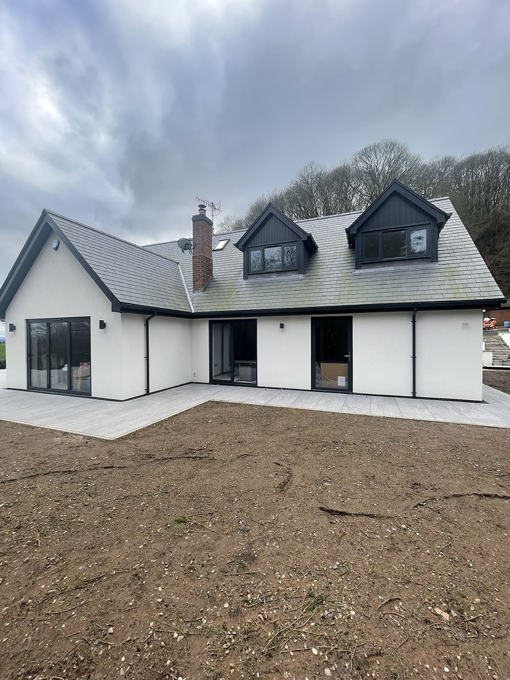 rendered house with 2 dormer windows